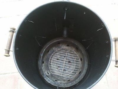 Charcoal pan with holes.jpg